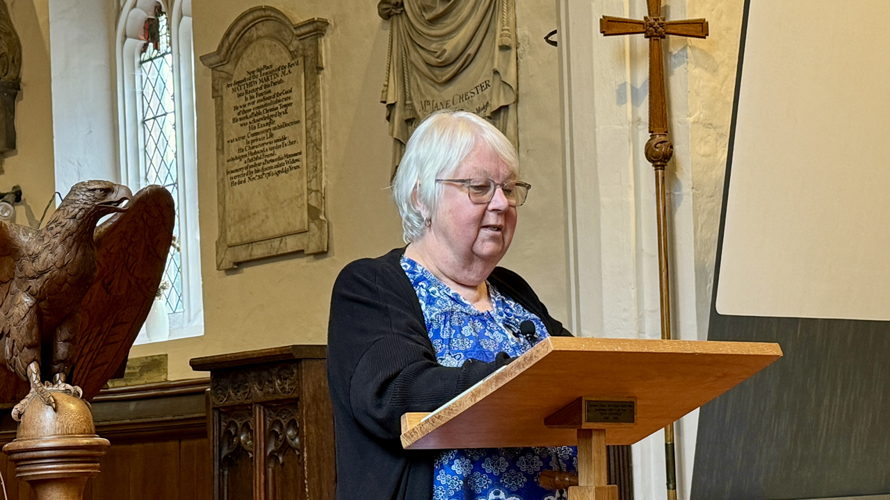 A lady making a presentation in church.