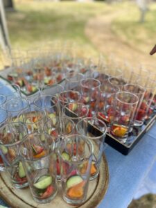 Glasses primed with fruit for Pimm's and punch.