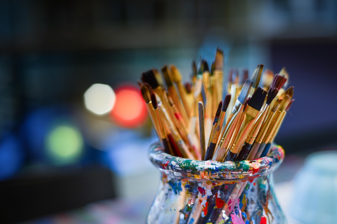 Paintbrushes in a jar.