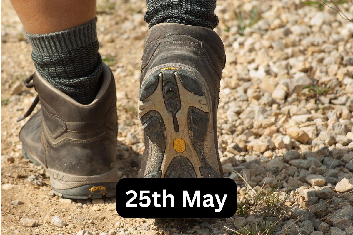 Feet in walking boots walking away from the camera. The date "25th May" is shown.